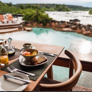 #WILDWATERS #lodge, this GEM lies on a unique private island mid-stream within the mighty #RiverNile in #Uganda. 
It’s only reached by boat which makes it a very #adventurous place to stay. And, it’s uniquely perched on granite rocks with noisy and exciting foamy rapids roaring all around. The lodge offers a relaxing and intimate stay for #honeymooners and couples looking for some quiet time if of-course the roar of the racing white-water rapids does not interfere. #rivernile #water #adventure #travel #tourism #explore #vacation #luxury #holidays #traveltheworld #pridenaturesafaris